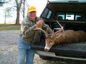 Ohio Deer Hunting Information - A photo of a happy hunter proudly showing his 13 pt drop tine. 